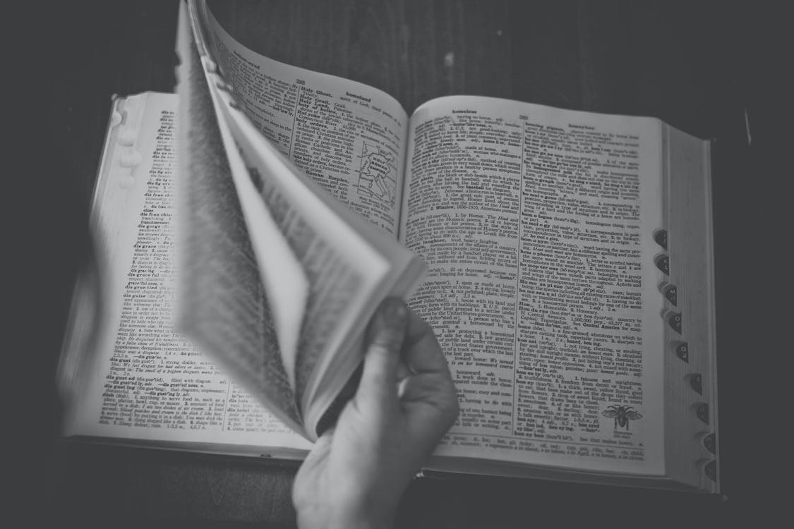 Hand browsing a dictionary