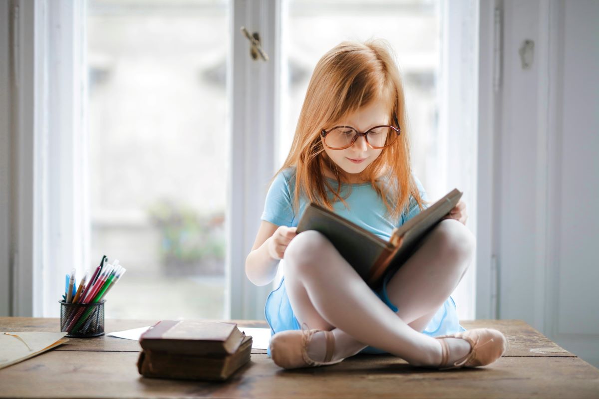A young girl is reading Harry Potter, showing how the book might be used to understand CEFR levels.