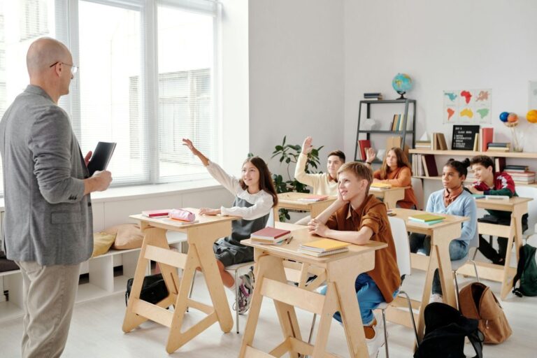 A teacher applying ESL teaching methods and techniques for his students that ensure the materials match their english level.
